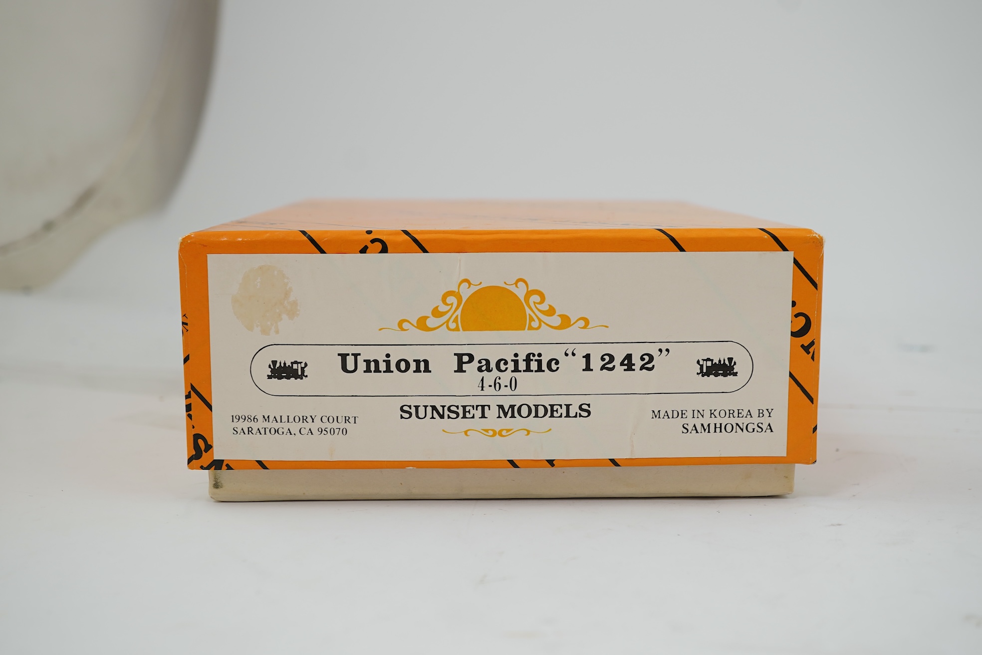 A boxed HO gauge Sunset Models unpainted brass model of Union Pacific 1242 4-6-0 locomotive with bogie tender, powered for two rail operation.